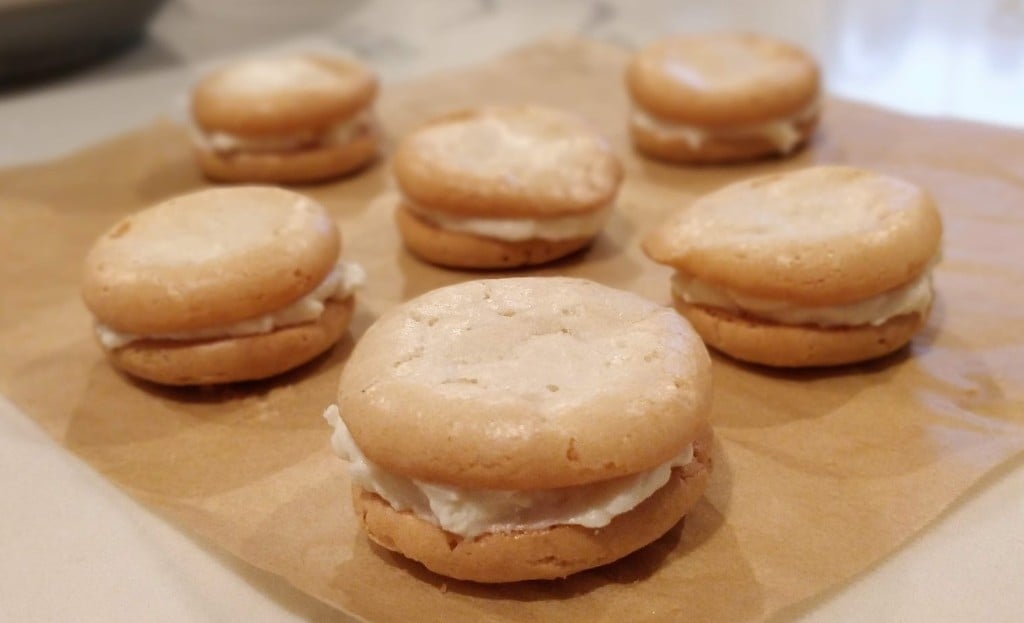First batch of sandwich cookies on parchment